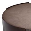 Round coffee table with wooden surface suspended between bronze legs