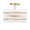 glamorous ceiling lamp in antique brass and encircled by ribbed clear glass