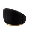 elegant black boucle upholstered swivel chair with brass base 