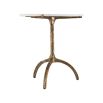 A stylish white marble dining table with a hammered antique brass base