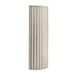 Brass ribbed wall light with gentle radiant glow