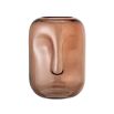 Brown glass vase with face design