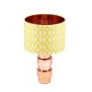 A luxury lampshade by Eva Sonaike with a yellow African-inspired pattern