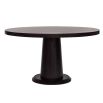 Smooth rounded top dining table elevated by a softly tapered cylinder base