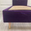 Luxurious purple ariel bed with striking headboard detail