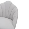 Light grey velvet chair with statement leaf backrest and tapered brass legs