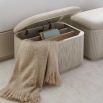 Elegant storage ottoman with ribbed detailing