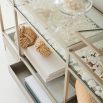 Minimal glass console table in coastal aesthetic hallway