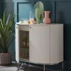 Glamorous contemporary bar cabinet with woven texture on the doors and silver base