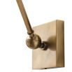 Antique brass wall light with woven wicker shade 