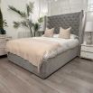Grey velvet bed with sumptuous deep buttoning on the headboard