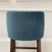 Gorgeous modern counter stool with blue velvet upholstery and dark wood legs