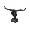 sculpture of a figure striking a pose with arms outstretched