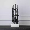 Visually intriguing black sculpture on white marble base