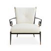 Black framed armchair with brass accents and linen seat and back cushions