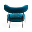 Blue velvet laid back lounge chair with brass accents