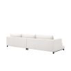 A contemporary white sofa with contrasting black legs 