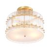 glamorous ceiling lamp in antique brass and encircled by ribbed clear glass