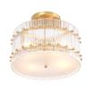 glamorous ceiling lamp in antique brass and encircled by ribbed clear glass