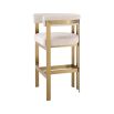 Glamorous brass frame bar stool and cream boucle upholstery