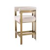 Glamorous brass frame counter stool and cream boucle upholstery