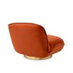 A beautiful upholstered savona orange velvet chair by Eichholtz with a brushed brass base 