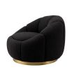 elegant black boucle upholstered swivel chair with brass base 