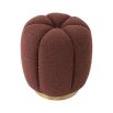 Striking rouge pouffe with boucle textured finish and glamorous brass plinth base