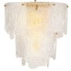 An elegant chandelier with textured glass that reflects a warm, radiant glow.