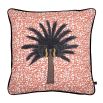 Exuberant tropical design cushion with copper coloured background