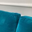 A luxurious teal-coloured 4-seater sofa