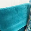 A luxurious teal-coloured 4-seater sofa