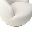Small and circular boucle sand swivel chair with rounded edges and brass base