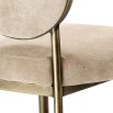 Elegant dining chair with greige upholstery and dark brass frame