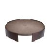 Round coffee table with wooden surface suspended between bronze legs