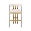 Glamorous brass frame bar stool and cream boucle upholstery