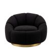 elegant black boucle upholstered swivel chair with brass base 