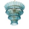 Elegant blue glass chandelier with curved panels