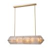 Handmade glass panels with an antique brass finish cast a warm, ambient glow.