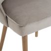 greige velvet chair with wooden legs