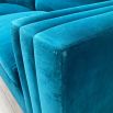 A luxurious teal-coloured 4-seater sofa