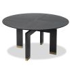 Smooth circular top dining table elevated by a sturdy geometric support
