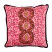 A luxury cushion by Eva Sonaike with a pink African-inspired pattern and fringing