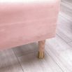 Gorgeous, statement kingsize bed with rounded, fluted headboard and blossom coloured upholstery