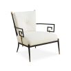 Black framed armchair with brass accents and linen seat and back cushions