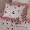 kids quilt and cushion set with cherry design and ruffled striped edges