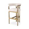 Glamorous brass frame bar stool and cream boucle upholstery