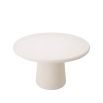 Round concrete dining table in cream for outdoor spaces