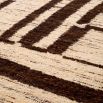 Sophisticated wool rug with brown textured pattern