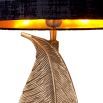 Extravagant leaf motif brass table lamp with black shade